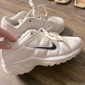 White Nike Air VXT II sneakers (tennis shoes).